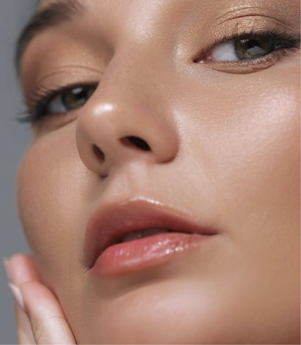 Close-up of woman's nose and lips from angled profile view
