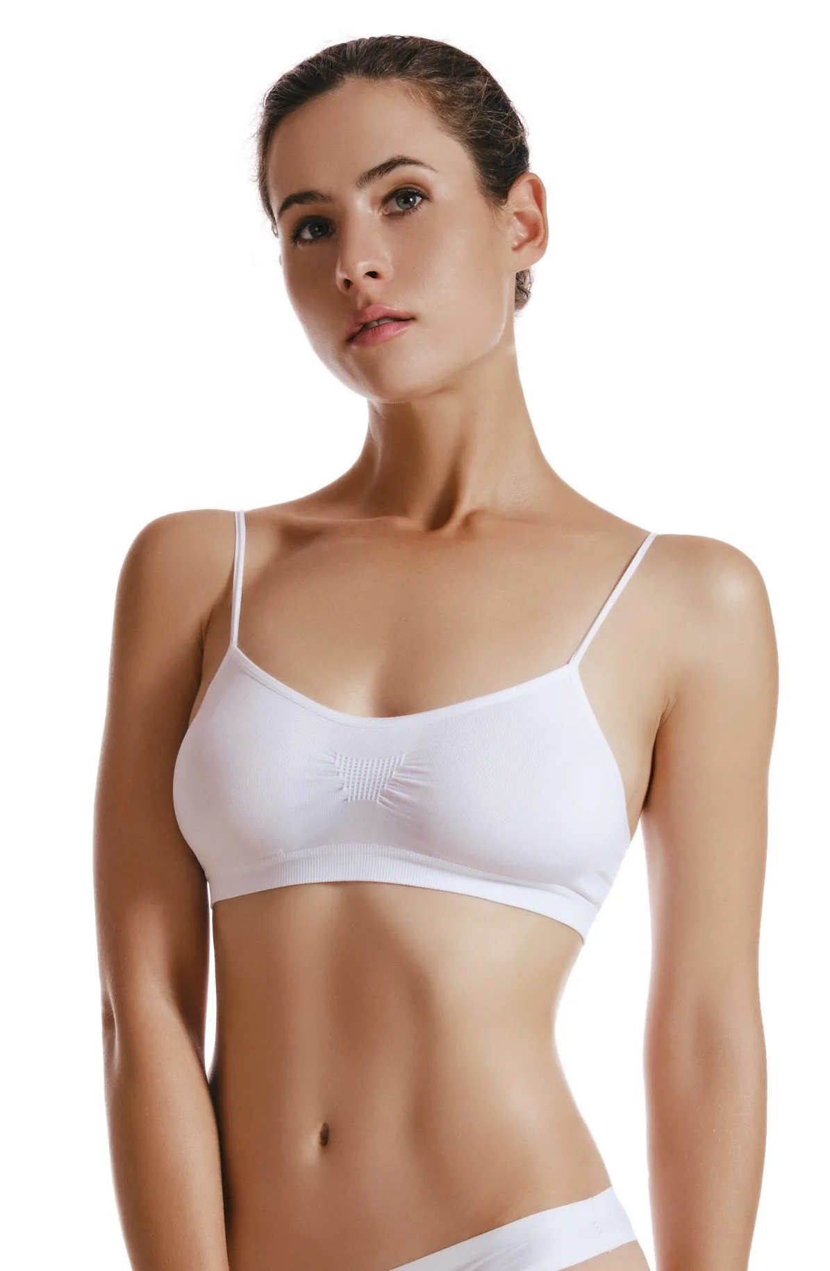Woman in white sports bra and underwear facing forward