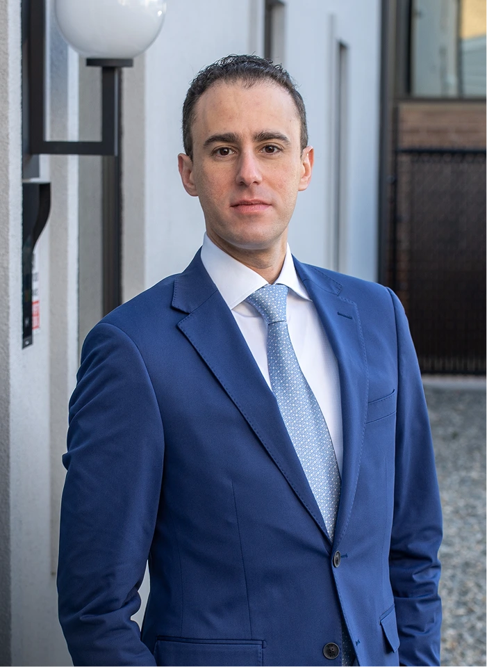 Professional portrait of Dr. Daniel Bienstock in blue suit and tie